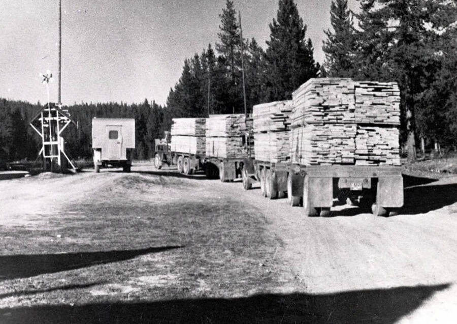 Loaded lumber trucks going through Dixie, Idaho.