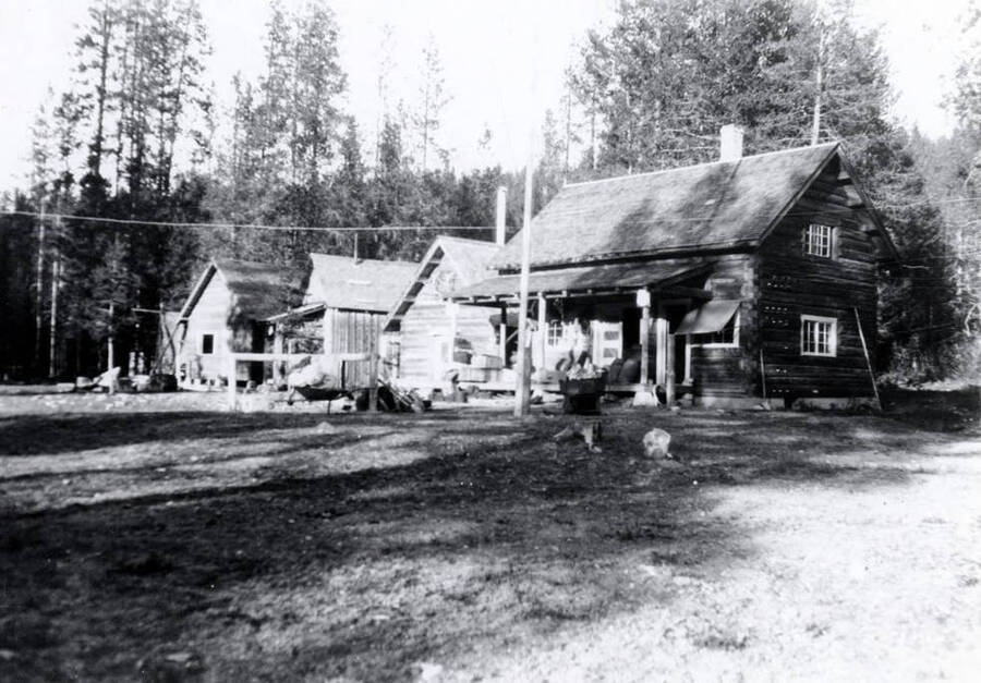 Dixie Ranger Station crew. L-R: new ranger dwelling under construction, old dwelling, winter-proof storage cellar, office and commissary