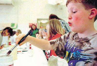 Children painting during Kidstown at Bovill's third grade.