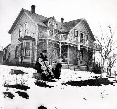 Mrs. McCallie, Annette and Horton McCallie in front of Dr. John Hugh McCallie home. Moscow, Idaho.