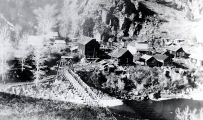 Shoup, Idaho showing bridge across river and homes.