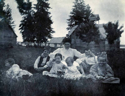 L-R: Jim Lyle, E.E. Rogers, Mrs. Helen Powell Heger, Donald Lyle, Harold L. Powell, Mrs. Mayme Rogers Hicks; in background Mrs. J. M. Lyle