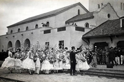 Brakeman' Rose Regan and the Apple Blossom girls flag a train. Celebration of coming of Union Pacific main line to Boise. Boise, Idaho.