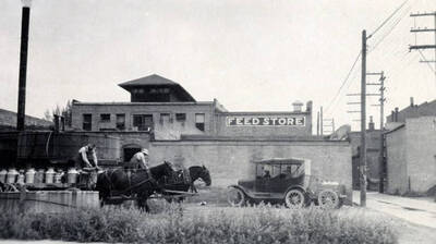 Team of horses and wagon loaded with cream cans. Creamery. Blackfoot, Idaho.