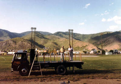 Kellogg mayor addressing a crowd from the back of the Builders Hardware truck. Old Miner's Day Parade. Kellogg, Idaho.