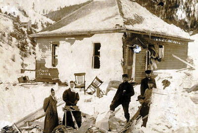 Cone home and a home demolished by snowslide. Mace, Idaho.