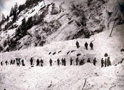 Men digging out after the snowslide. Mace, Idaho.