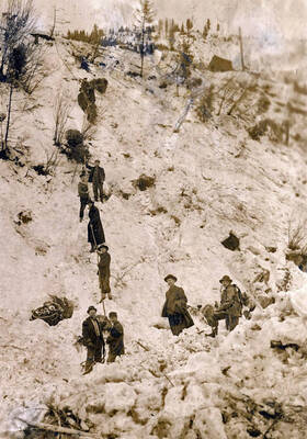 Men digging out after the snowslide. Mace, Idaho.