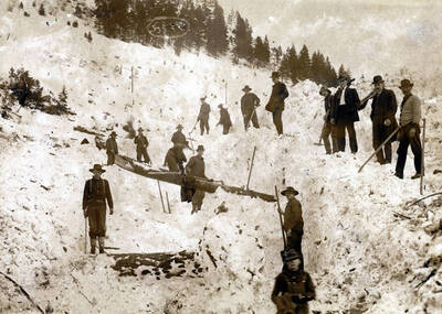 Men digging out after the snowslide. Mace, Idaho.