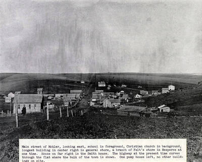 School in foreground, Christian church in background, longest building center right is general store