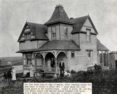 Couple on porch, Mr. And Mrs. John Smith, Luella with horse, Goldie Smith with child, other man is Goldie's husband