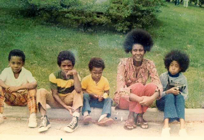 Alice Coltrane with all of her children. She had three boys (Ravi, Oranyan, & John Jr.) on the left, with John Coltrane, and a girl (Michelle Hagod) on the left