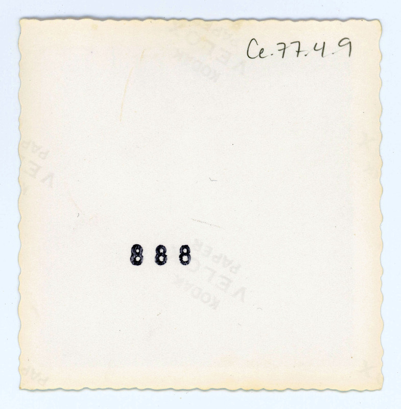 The back of a printed picture labelled "888".