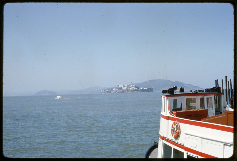 A photographic slide of a scenic view of a body of water taken from a boat.