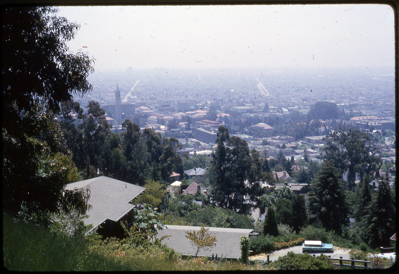 A photographic slide of a scenic overlook of a town.