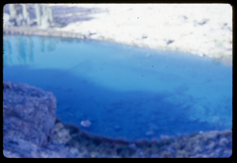 A photographic slide of a blurry view of a river.