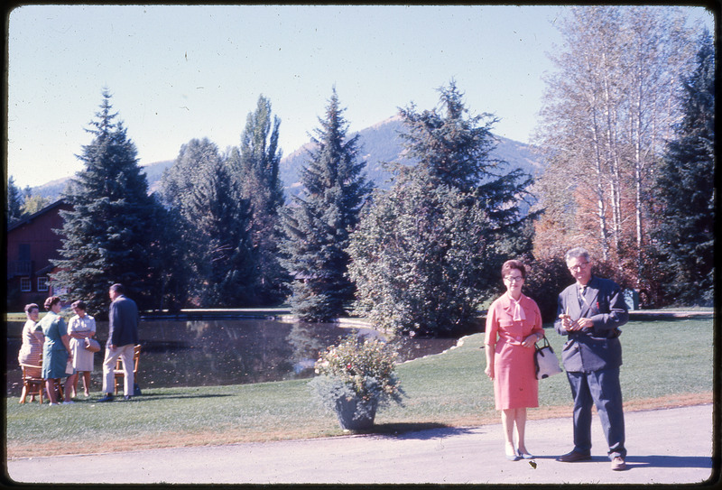 A photographic slide of Evelyn Crabtree and Francois Bordes standing in front of a park with a pond.