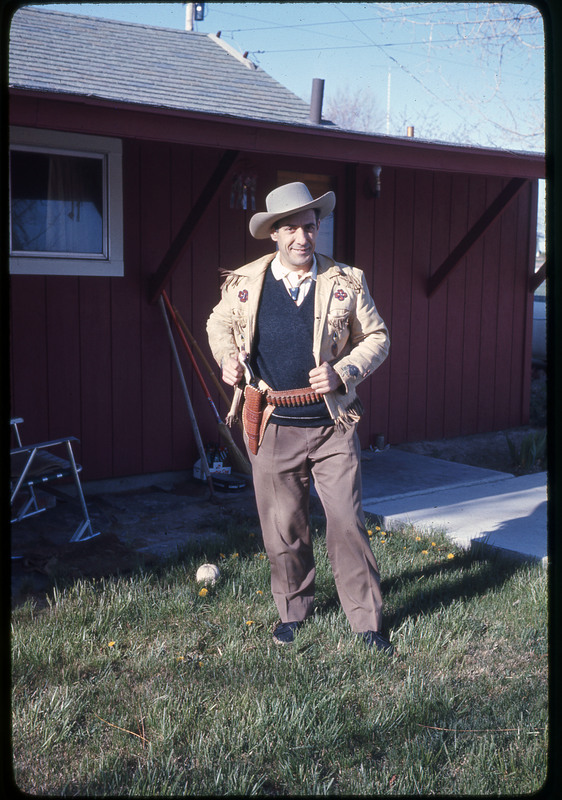 A photographic slide of a man posing in cowboy apparel.