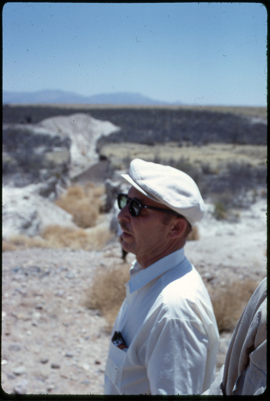 A photographic slide of a blurry view of Don E. Crabtree standing in a desert.