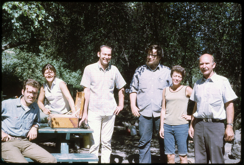 A photographic slide of Don E. Crabtree and the participants of his lithic field school smiling together.