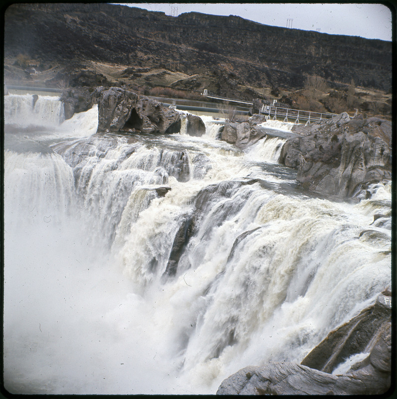 A photographic slide of a large waterfall. There is a canyon in the background.