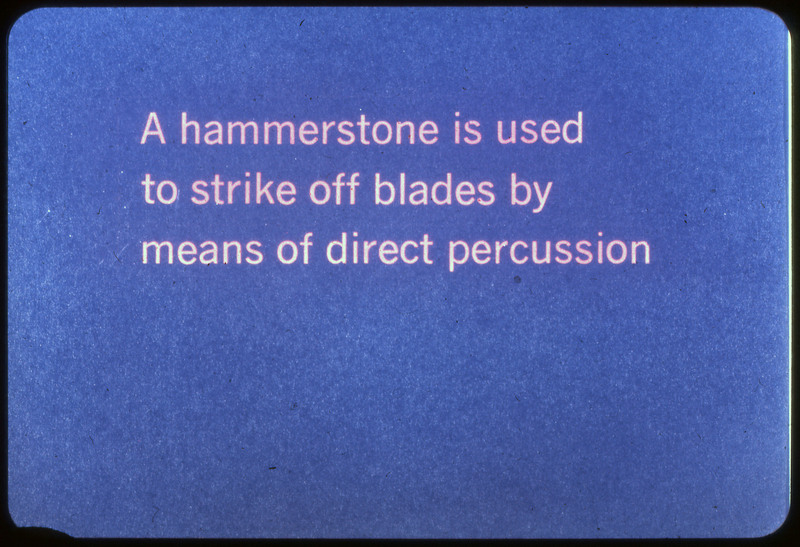 A photographic slide of a blue slide stating, "A hammerstone is used to strike off blades by means of direct percussion."