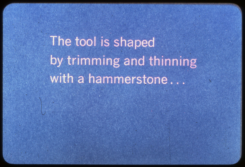 A photographic slide of a blue slide stating, "The tool is shaped by trimming and thinning with a hammerstone..."