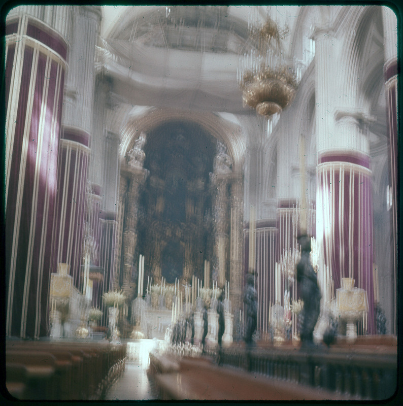 A photographic slide of a blurry image of the inside of a cathedral.