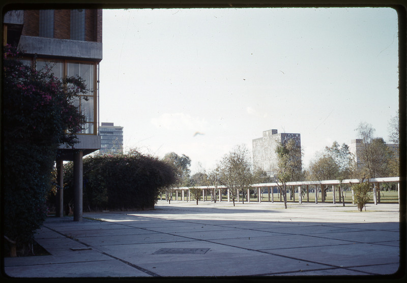 A photographic slide of an urban campus with geometric buildings.