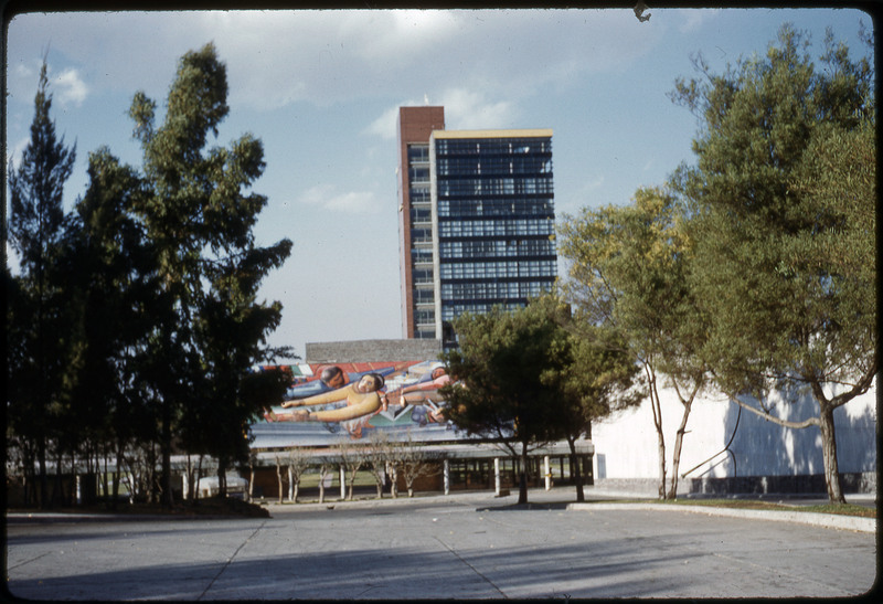 A photographic slide of an urban campus with geometric buildings.