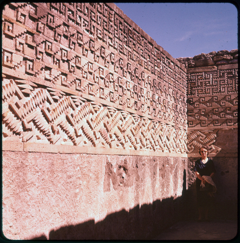 A photographic slide of a stone wall made with bricks arranged in different geometric designs.