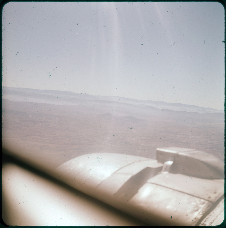 An aerial view of mountains likely from an airplane.