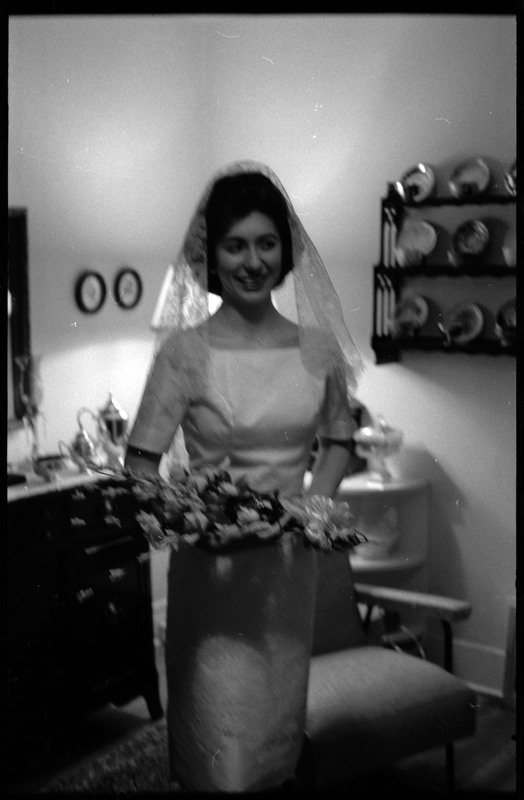 A photo of a woman wearing a wedding dress, holding a bouquet of flowers, and smiling for the camera. Associated with item numbers: ce_b83_f1-item1-017 through ce_b83_f1-item1-036.
