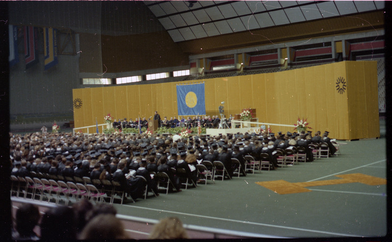 A photo of a group of people in the crowd at a graduation ceremony at the University of Idaho.