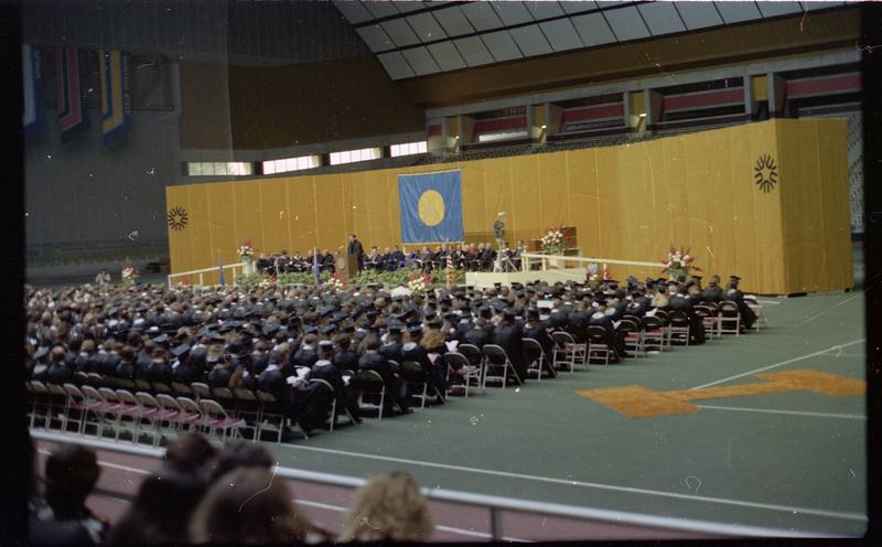 A photo of a group of people in the crowd at a graduation ceremony at the University of Idaho.