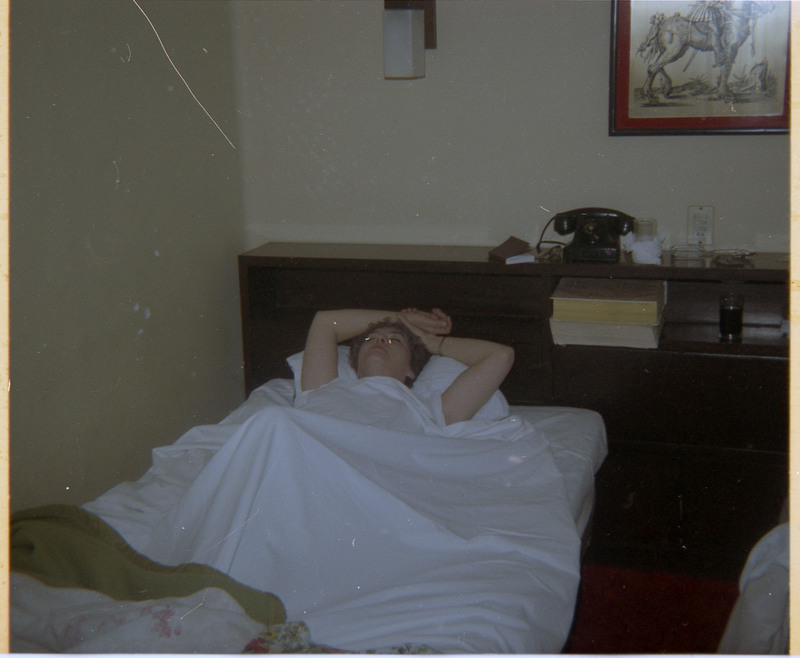 A photograph of Evelyn Crabtree lying on a bed.