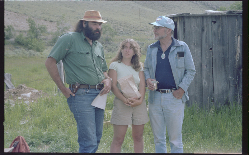 A photo of Donald Crabtree and two unnamed people. The photo was taken outside. Associated item numbers: ce_b83_f2-item4-029 and ce_b83_f2-item4-031 through ce_b83_f2-item4-042.