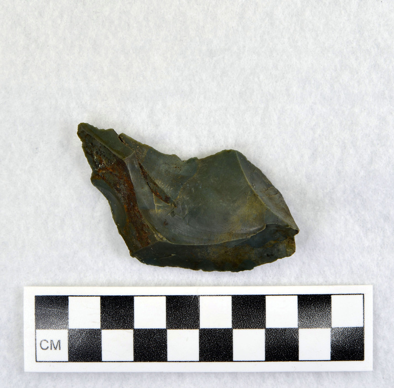 Part of Donald E. Crabtree's experiments with heat treating stone. Ce.7940 is a fragment of Ce.7939. This specific experiment had the stone heat treated from 8:00am to 3:00pm in electric furnace peaking at 1700 degrees F. The object is a percussion flake and is associated with Ce.7892-Ce.7939.