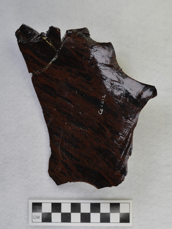 One of several macro flakes from Glass Butte, obsidian by Donald E. Crabtree. broken/glued Damaged while on exhibit, 1986. Condition: was partially repaired, see CE_CB_D2_1212-1213 for other pieces of this macro flake