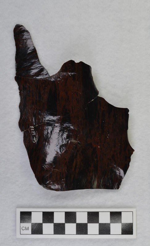 One of several macro flakes from Glass Butte, obsidian by Donald E. Crabtree. broken/glued Damaged while on exhibit, 1986. Condition: was partially repaired, see CE_CB_D2_1212-1213 for other pieces of this macro flake