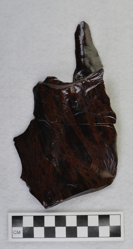 One of several macro flakes from Glass Butte, obsidian by Donald E. Crabtree. broken/glued Damaged while on exhibit, 1986. Condition: was partially repaired, see CE_CB_D2_1212-1213 for other pieces of this macro flake
