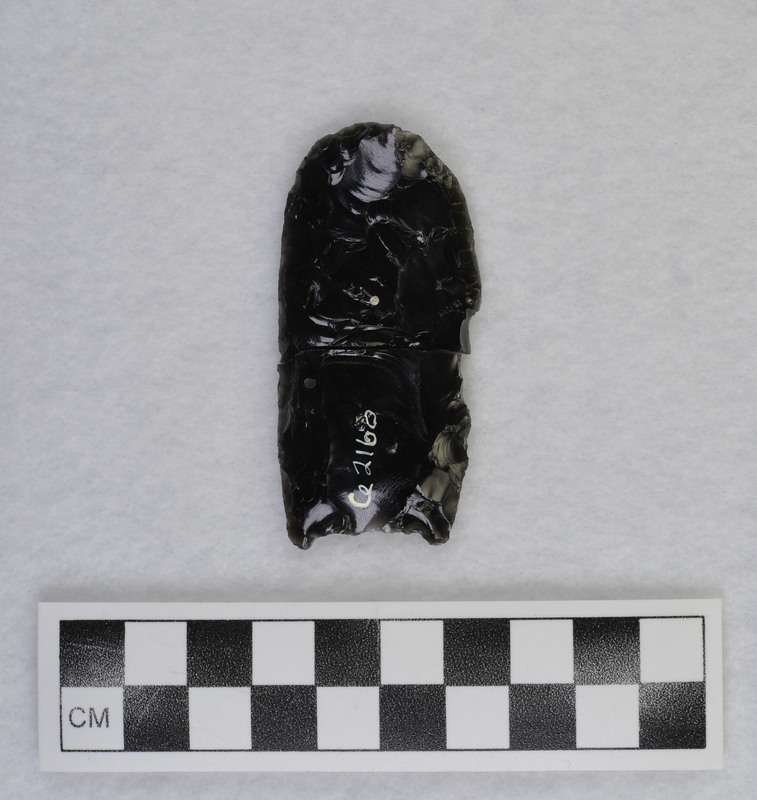 Fluted, broken during fluting process 5/9/69. Preform made by direct percussion on large flake. Flutes - indirect percussion punch technique held between feet. (JW)