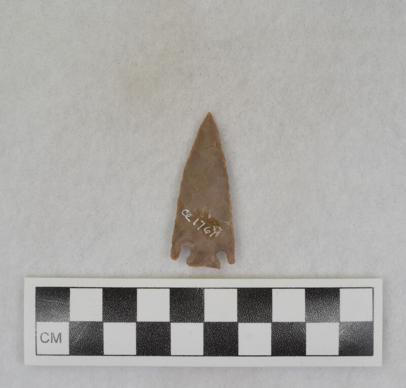 A corner notched, projectile point created by Donald E. Crabtree. The flint material used was sourced from Palestine.