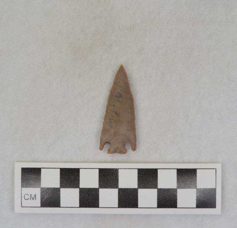 A corner notched, projectile point created by Donald E. Crabtree. The flint material used was sourced from Palestine.