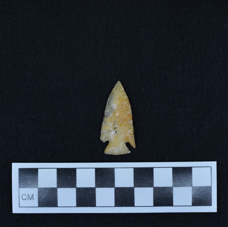 Corner notched, one ear broken; from sawn slab