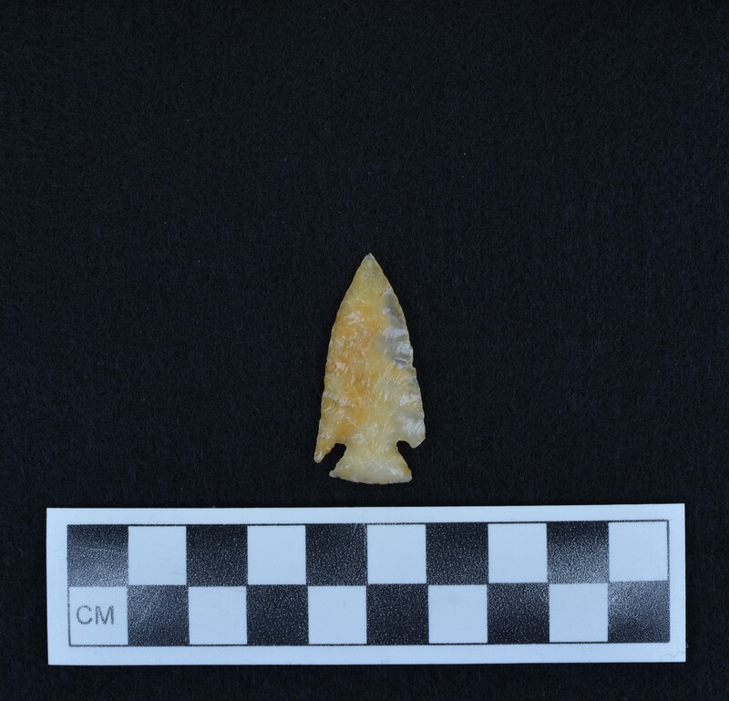 Corner notched, one ear broken; from sawn slab