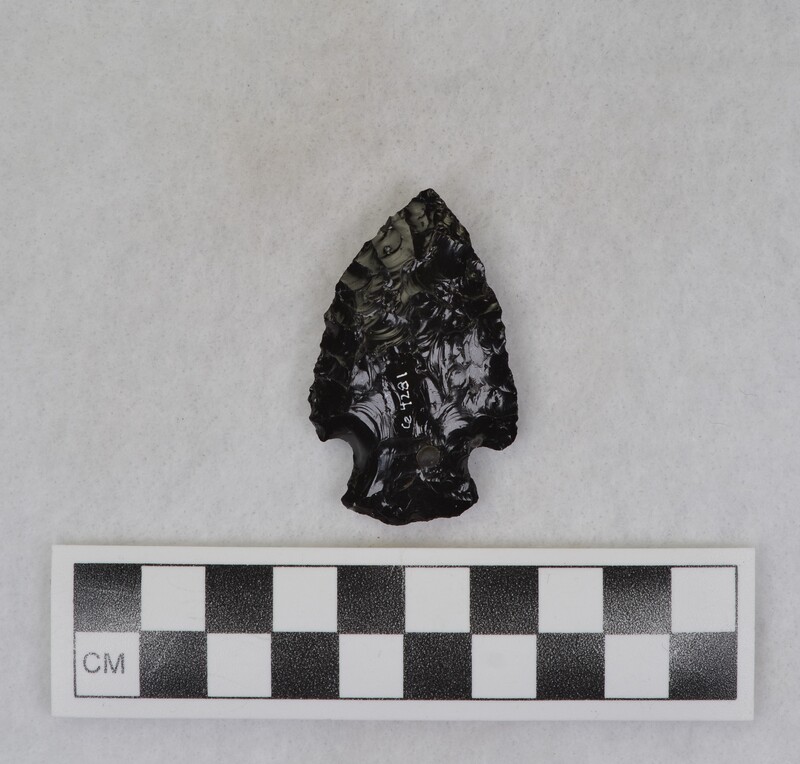 Corner notched, Material source is uncertain, but because of the phenocrysts presence it is probably from a source east of Pocatello, Idaho. (JW)