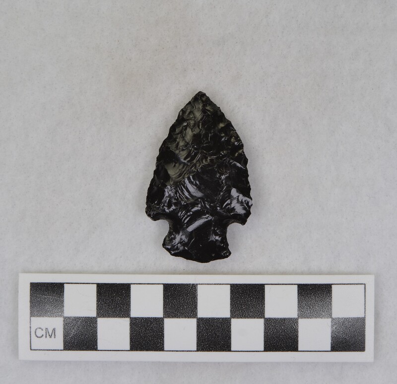 Corner notched, Material source is uncertain, but because of the phenocrysts presence it is probably from a source east of Pocatello, Idaho. (JW)