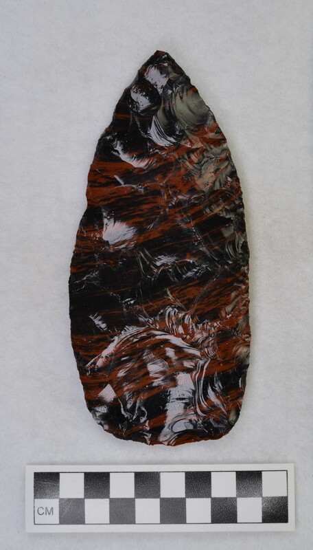 A large, mahogany obsidian biface. Donald E. Crabtree produced this biface using an antler billet.