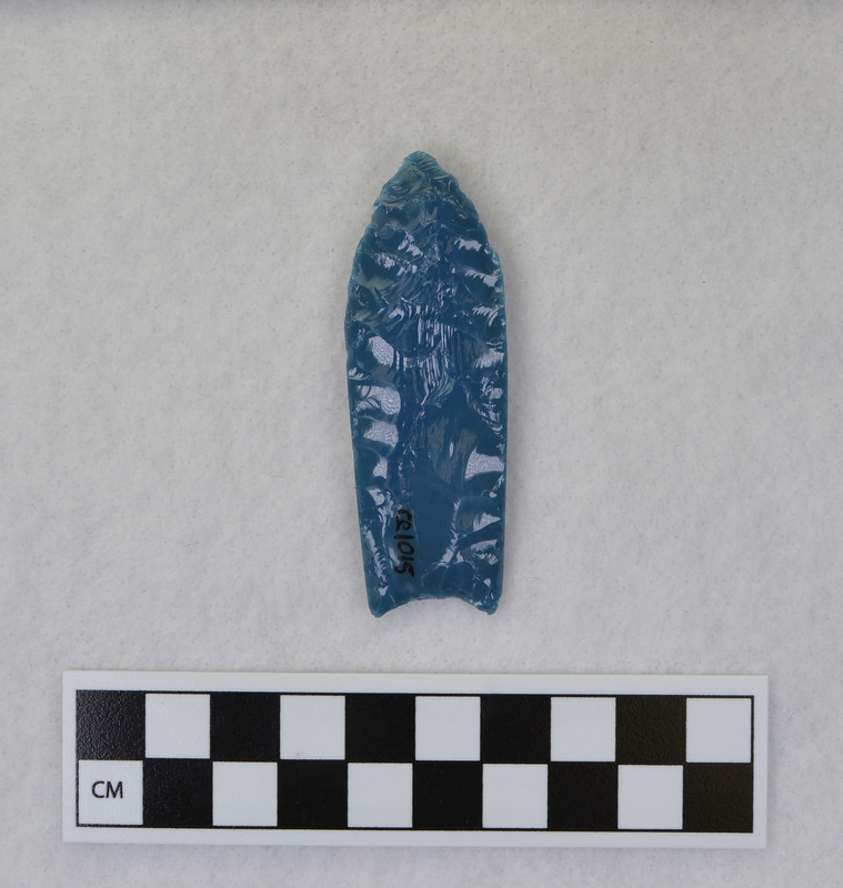 A fluted point created by Donald E. Crabtree from light blue glass as part of his fluting experiements. Associated with objects Ce.1016, Ce.1017, Ce.1019, Ce.1020.
